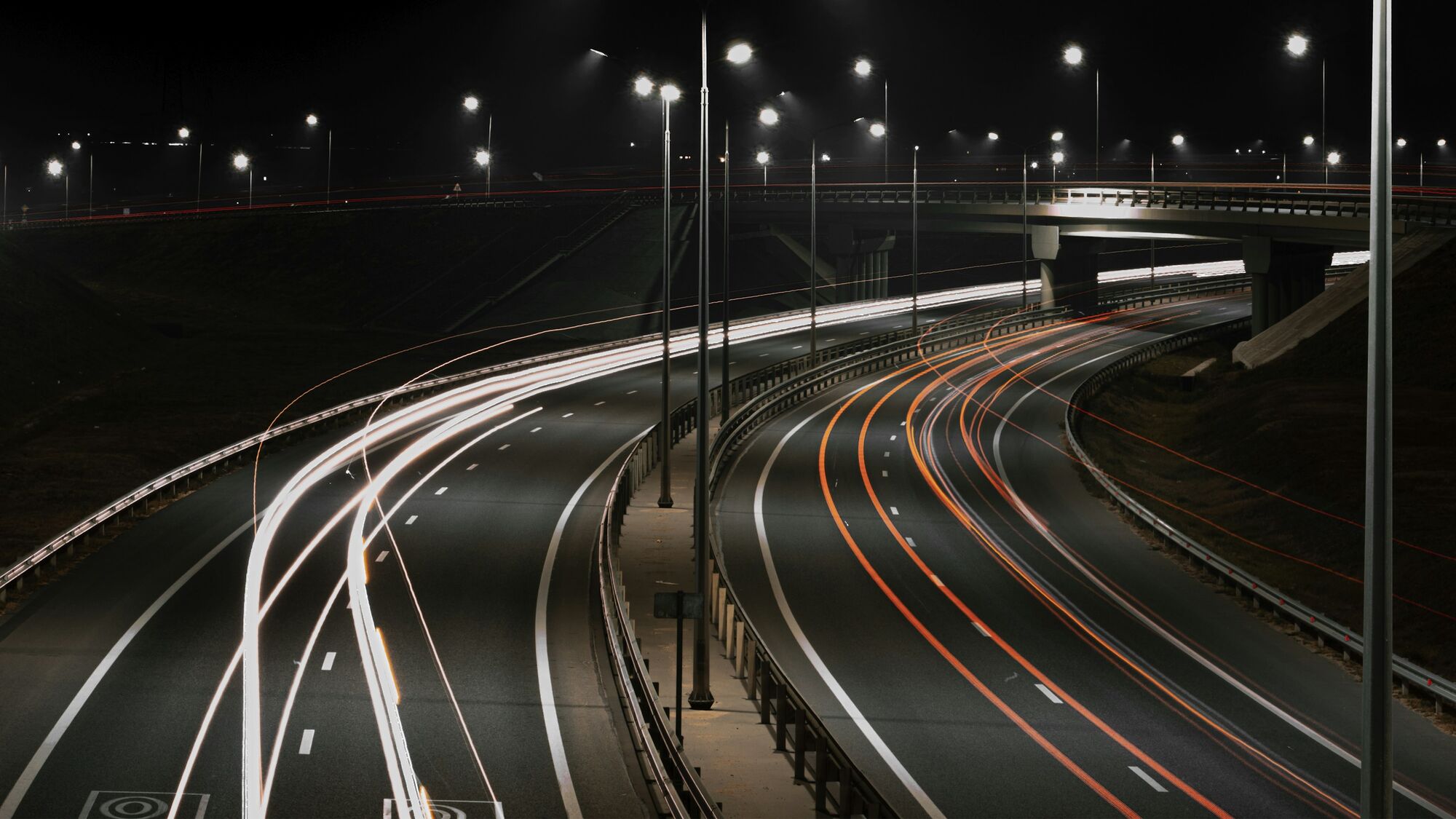 Highway corridor at dusk with roadway lighting and ITS cabinets along a Georgia transportation route